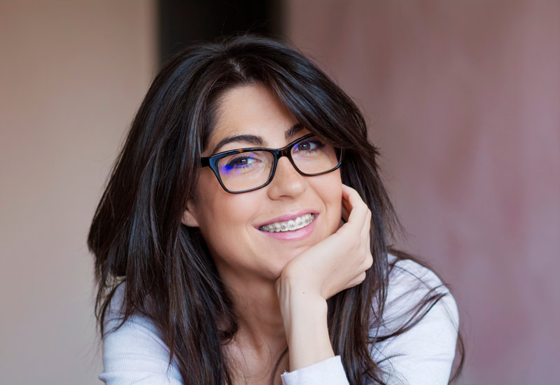 Portrait of a Beautiful Woman with Braces on Teeth. Orthodontic Treatment in Fairfield County, CT